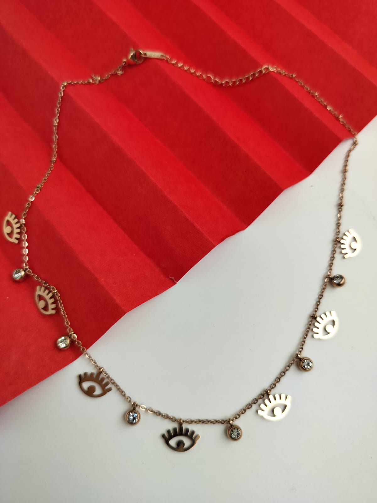 Charms evil eye necklace in rose gold