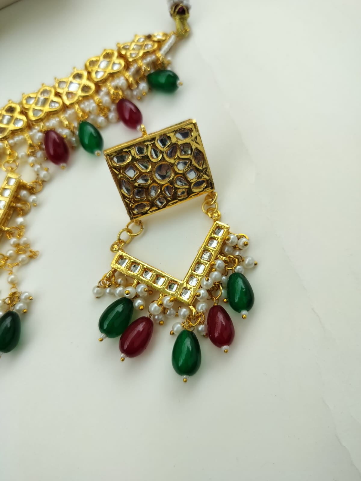 Green and red Ankita Kundan Jewellery Set